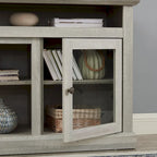 Meuble TV gris pierre 60 pouces avec gestion des câbles, portes vitrées et étagères réglables pour téléviseurs jusqu'à 65 pouces.