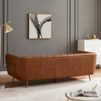 Canapé Clovis de style moderne du milieu du siècle, recouvert de cuir couleur cognac.